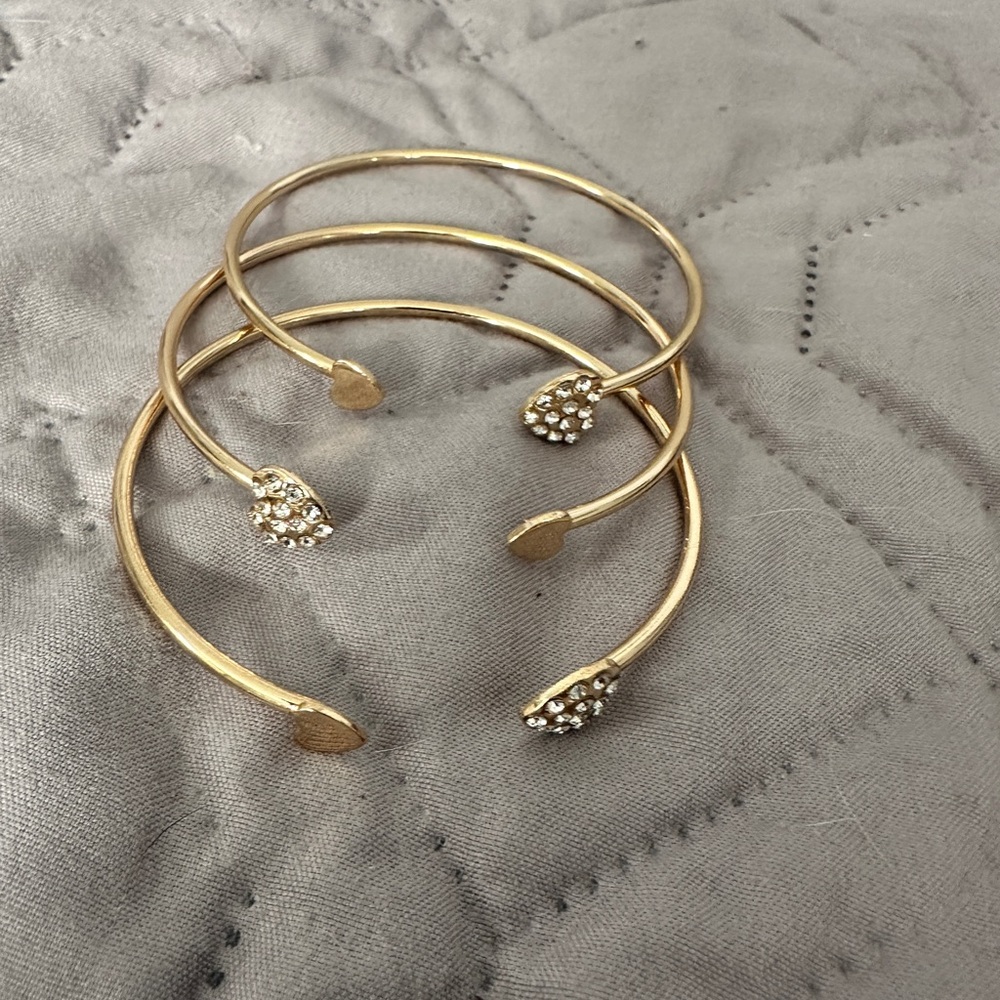 Set of 3 gold tone stackable bracelets